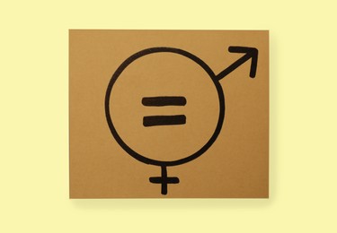 Photo of Gender equality. Card with equal sign, male and female symbols on blue background, top view