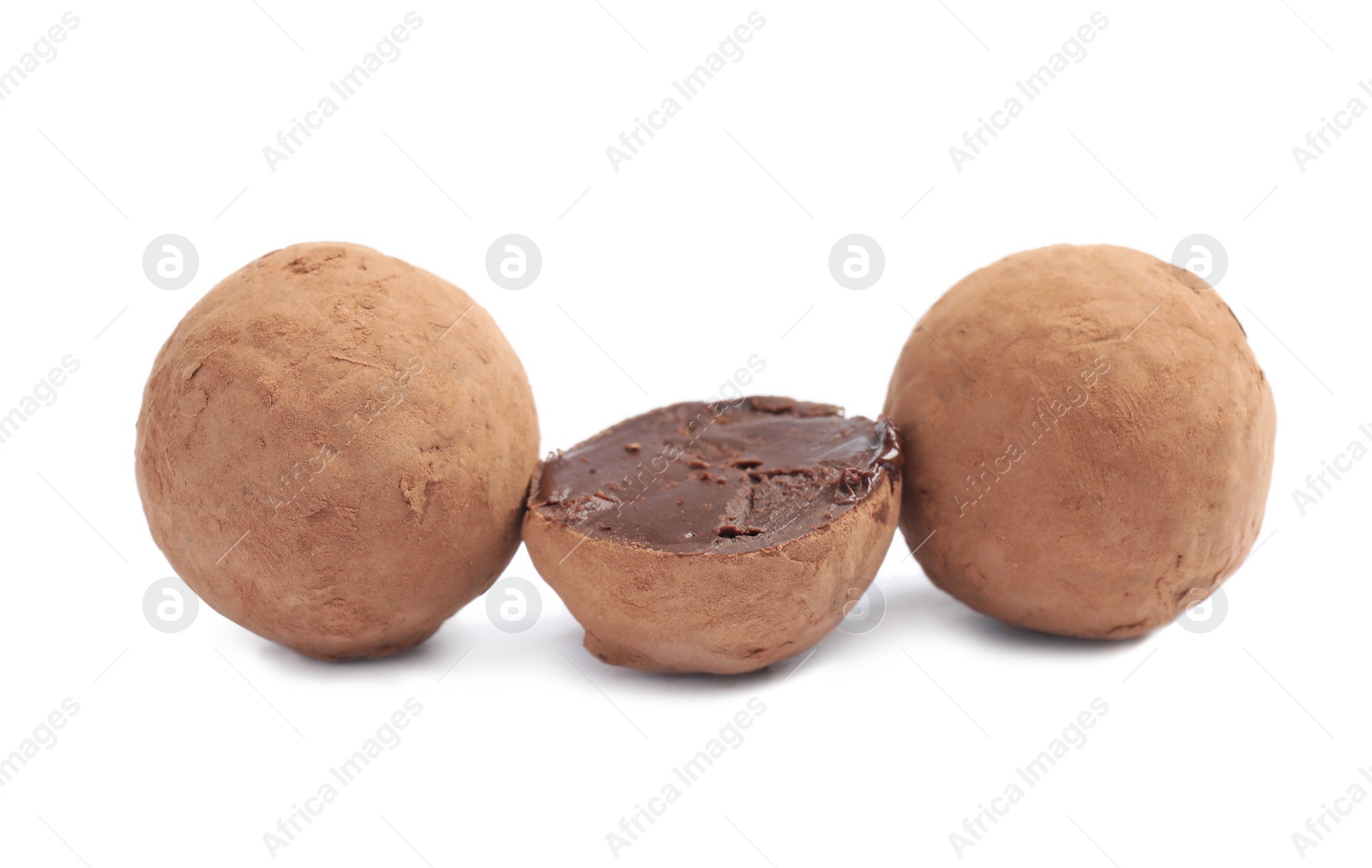 Photo of Delicious raw chocolate truffles on white background