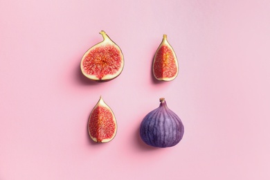 Fresh ripe figs on color background, top view