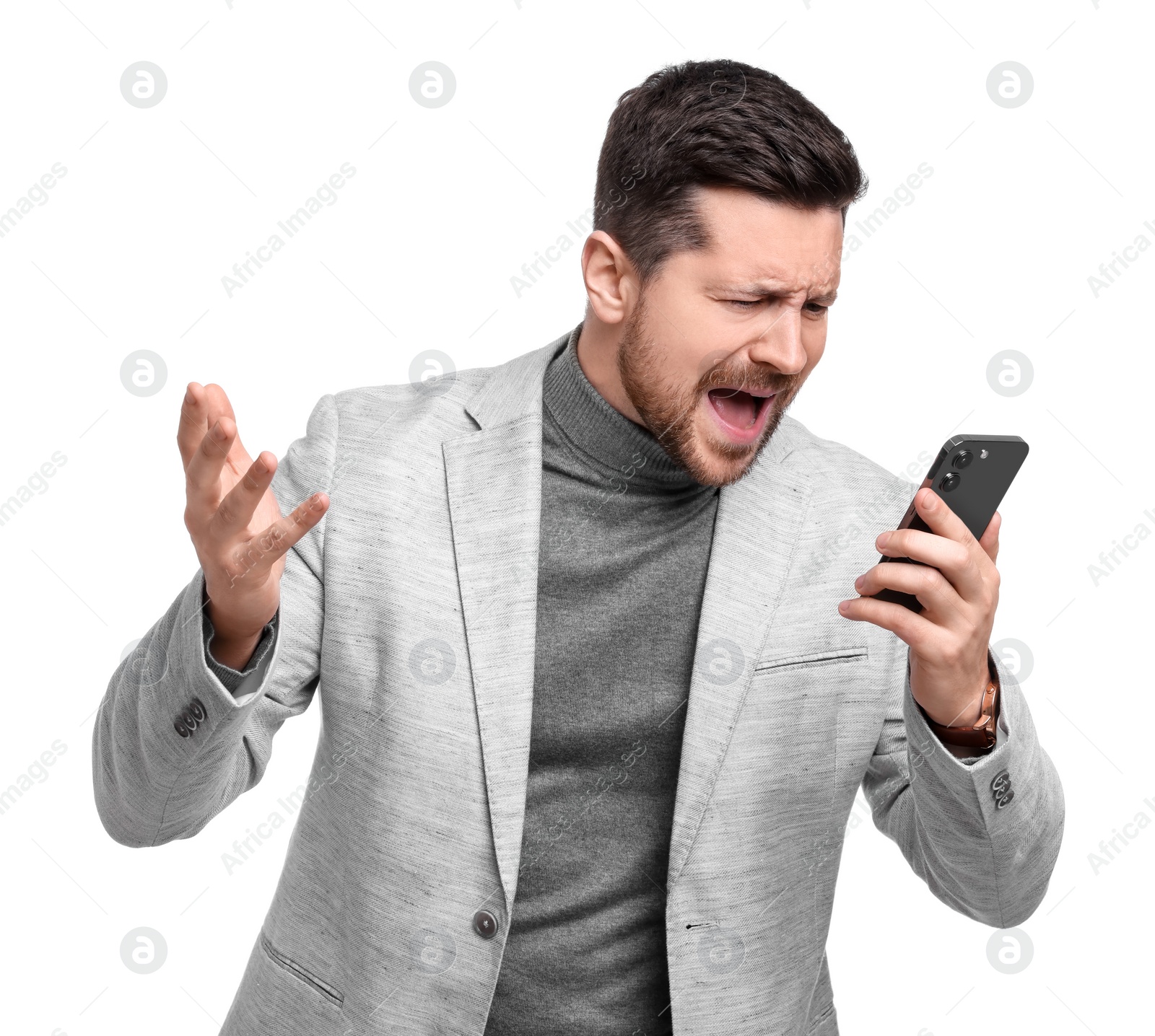 Photo of Emotional businessman talking on smartphone against white background