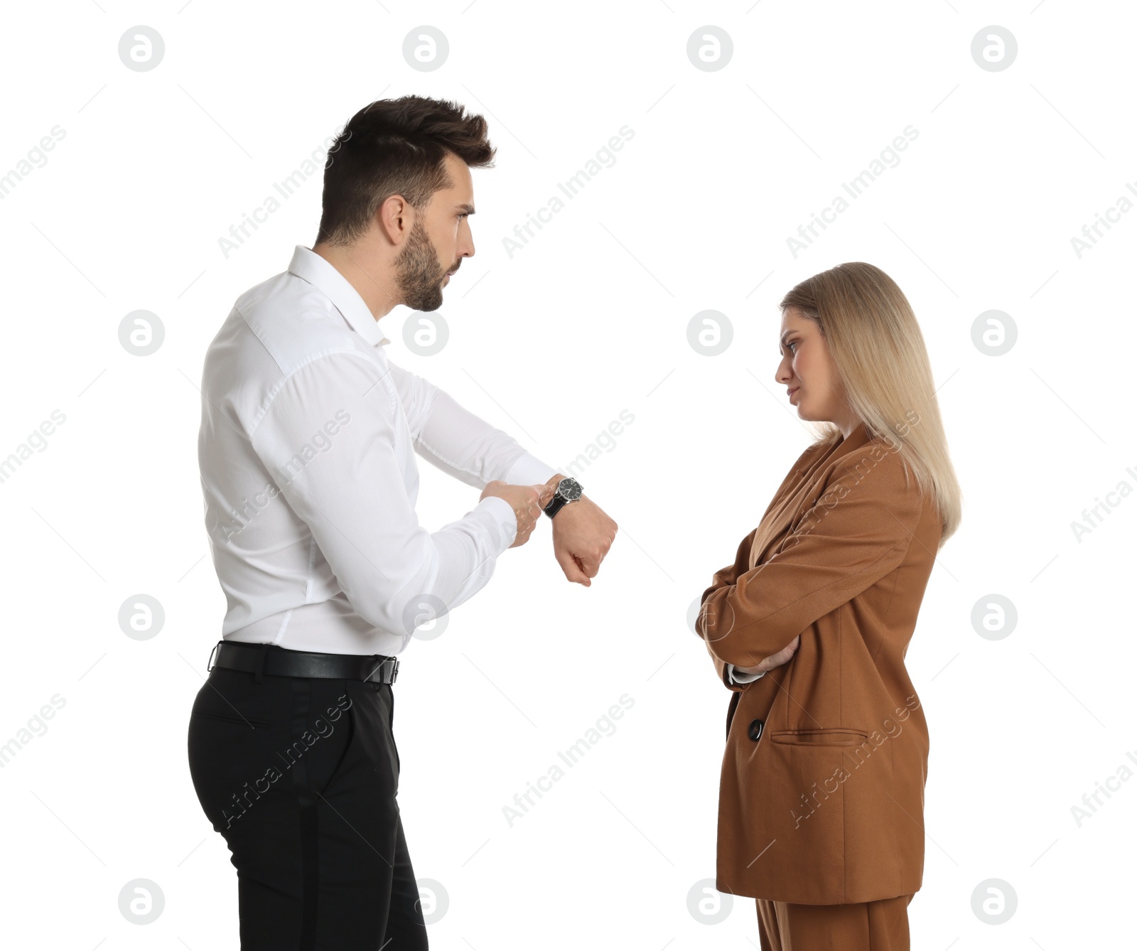 Photo of Businessman pointing on wrist watch while scolding employee for being late against white background