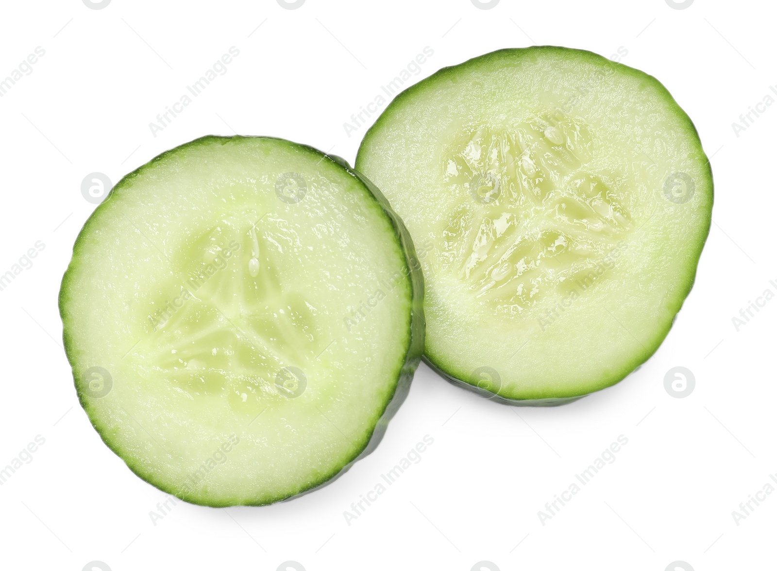 Photo of Slices of fresh cucumber isolated on white, above view