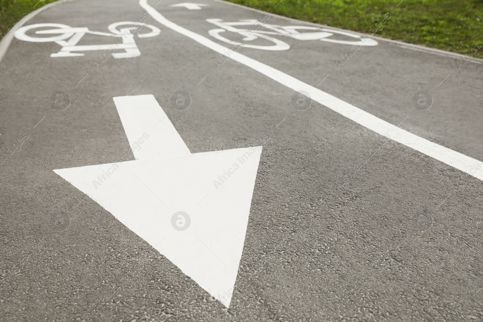 Photo of Two way bicycle lane with white markings on asphalt