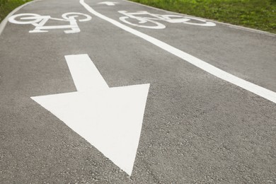 Two way bicycle lane with white markings on asphalt