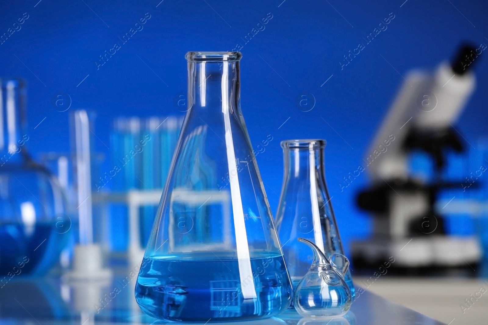 Photo of Laboratory glassware on table indoors. Chemical analysis