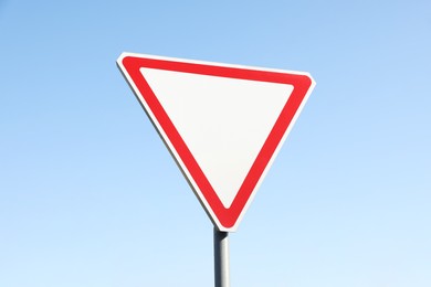 Traffic sign Yield outdoors on sunny day