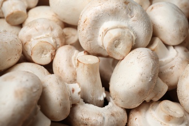 Photo of Fresh champignon mushrooms as background. Healthy food