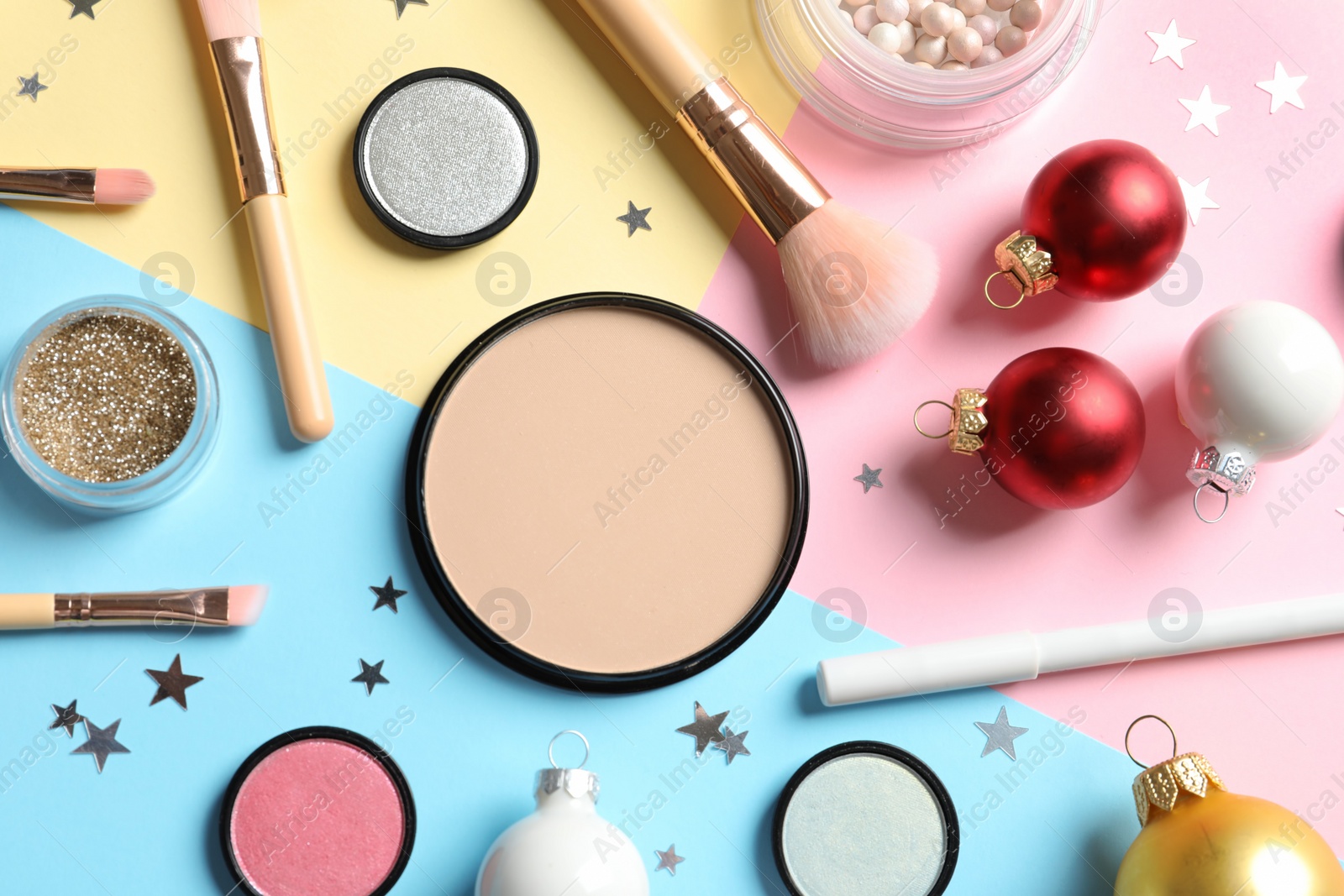 Photo of Flat lay composition with makeup products and Christmas decor on color background