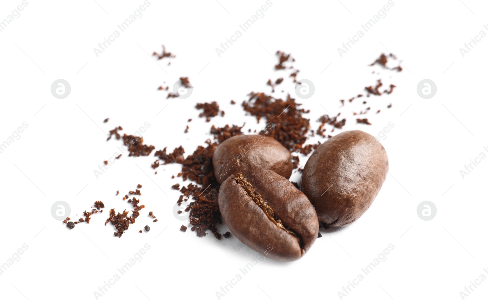 Photo of Coffee grounds and roasted beans on white background