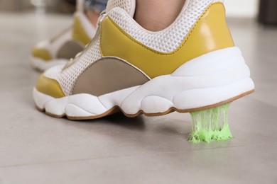 Person stepping into chewing gum on floor, closeup