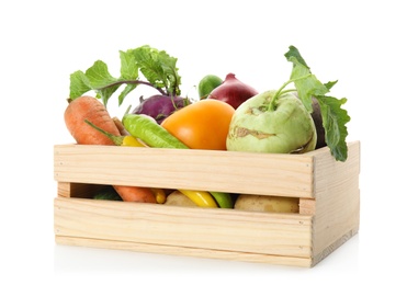 Photo of Fresh ripe vegetables in wooden crate on white background