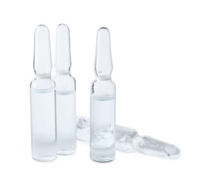 Photo of Pharmaceutical ampoules with medication on white background