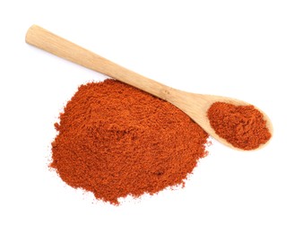 Photo of Wooden spoon and aromatic paprika powder isolated on white, top view