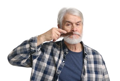 Senior man combing beard with comb on white background