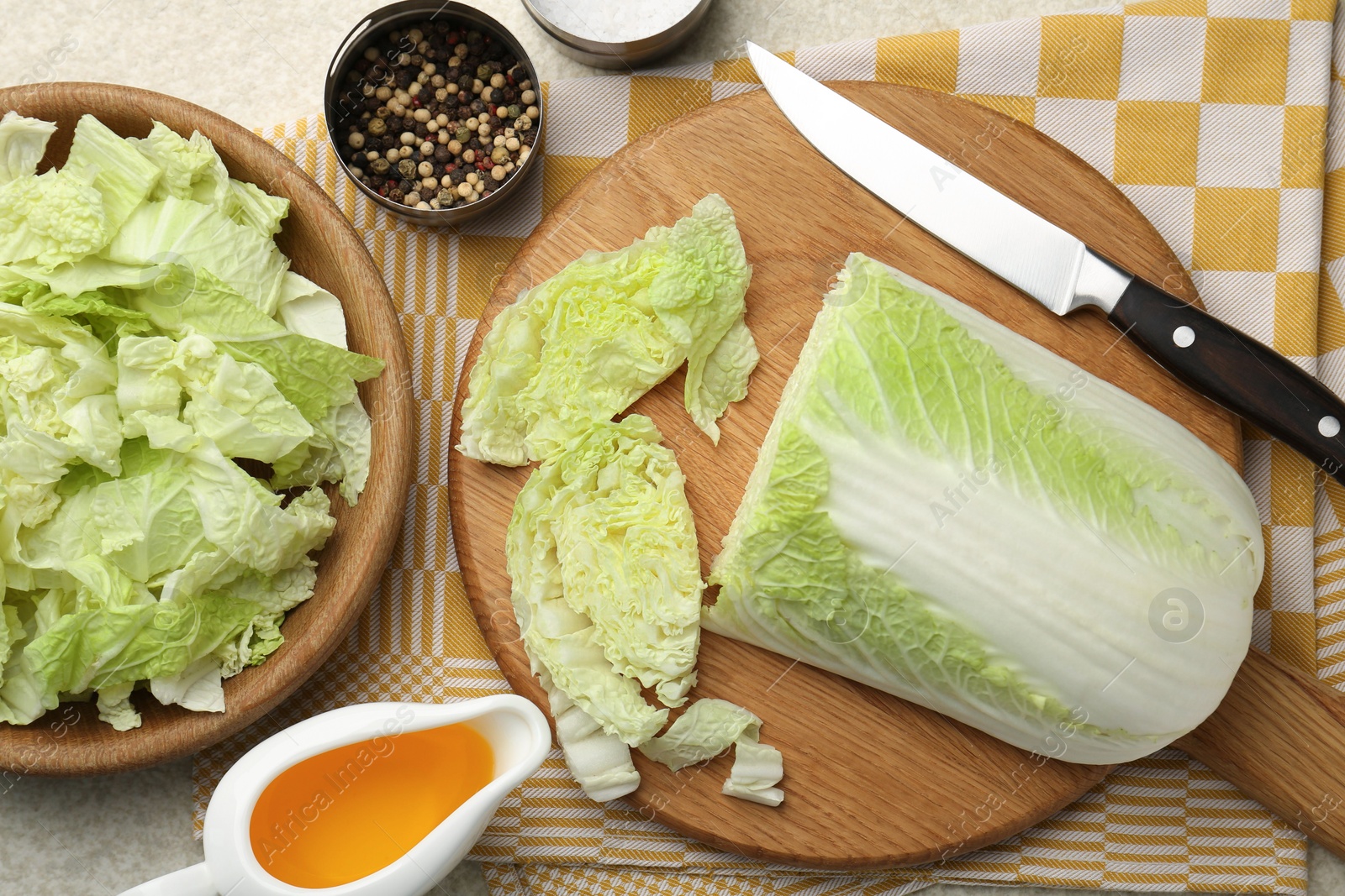 Photo of Cut fresh Chinese cabbage, oil and spices on light table, flat lay