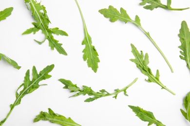 Photo of Fresh arugula on white background, flat lay