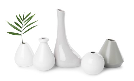 Many different stylish vases on white background