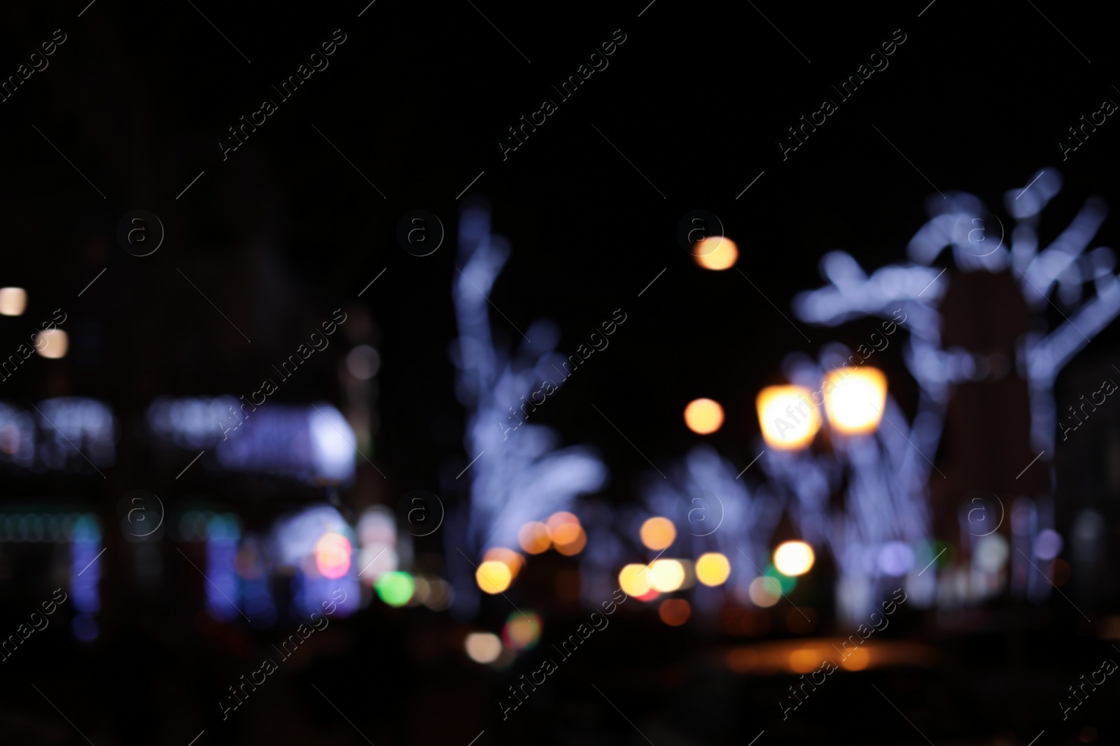 Photo of Beautiful street lights at night. Bokeh effect