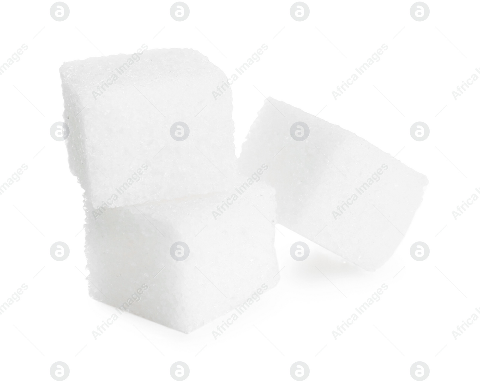 Photo of Three refined sugar cubes isolated on white