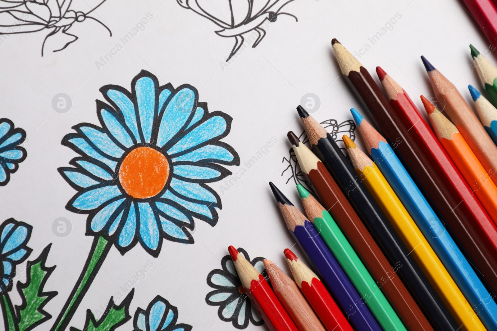 Photo of Child's colored drawing with pencils, flat lay