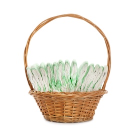 Photo of Wicker basket with disposable diapers on white background. Baby accessories