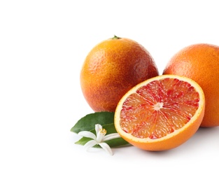 Ripe blood oranges, leaves and flower on white background. Citrus fruit