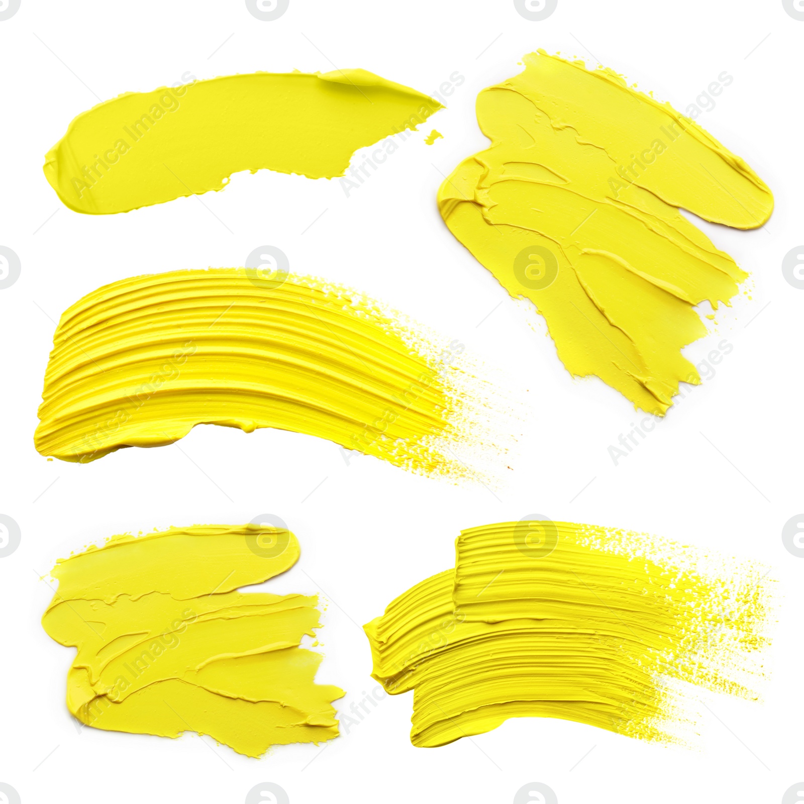 Image of Yellow oil paint strokes isolated on white, top view