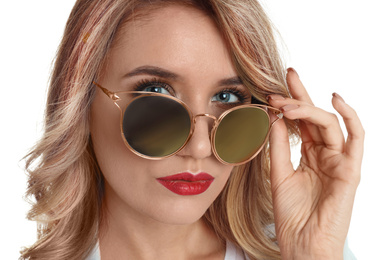 Young woman wearing stylish sunglasses on white background