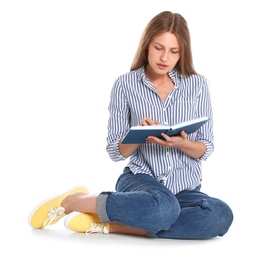 Beautiful young woman reading book on white background