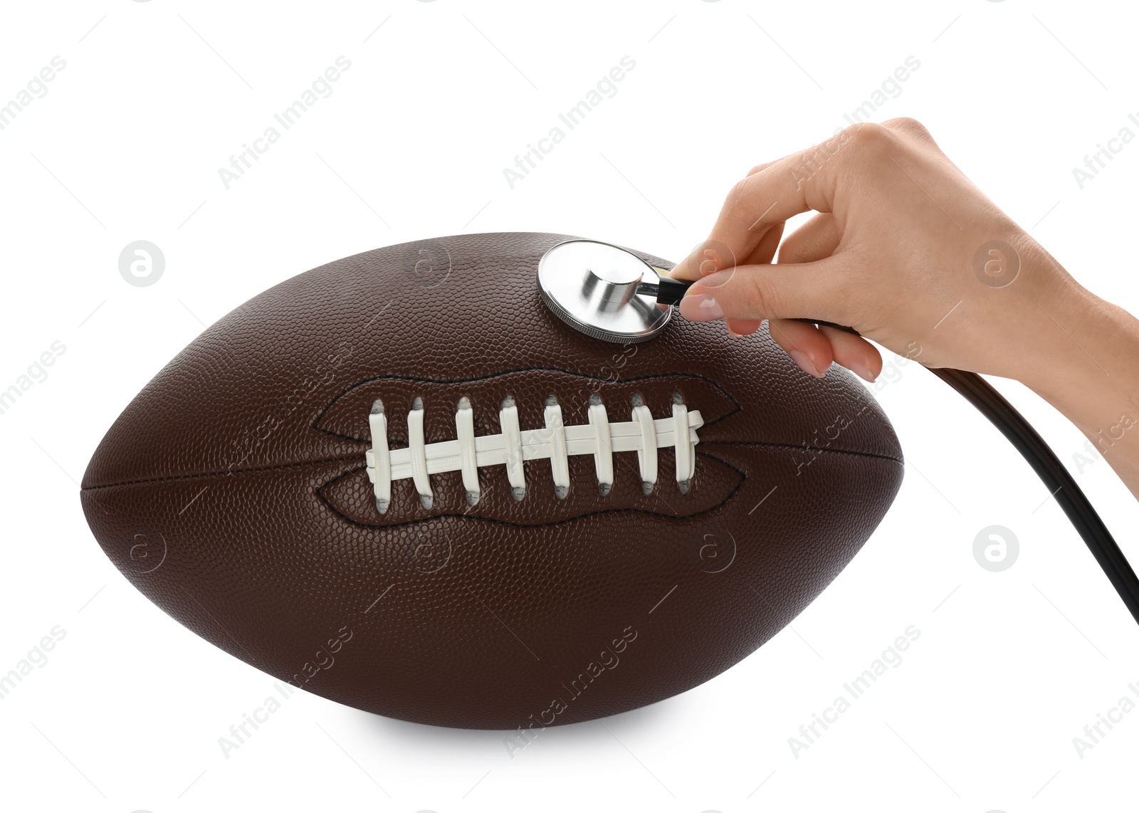 Photo of Woman examining American football ball with stethoscope on white background, closeup. Doping concept