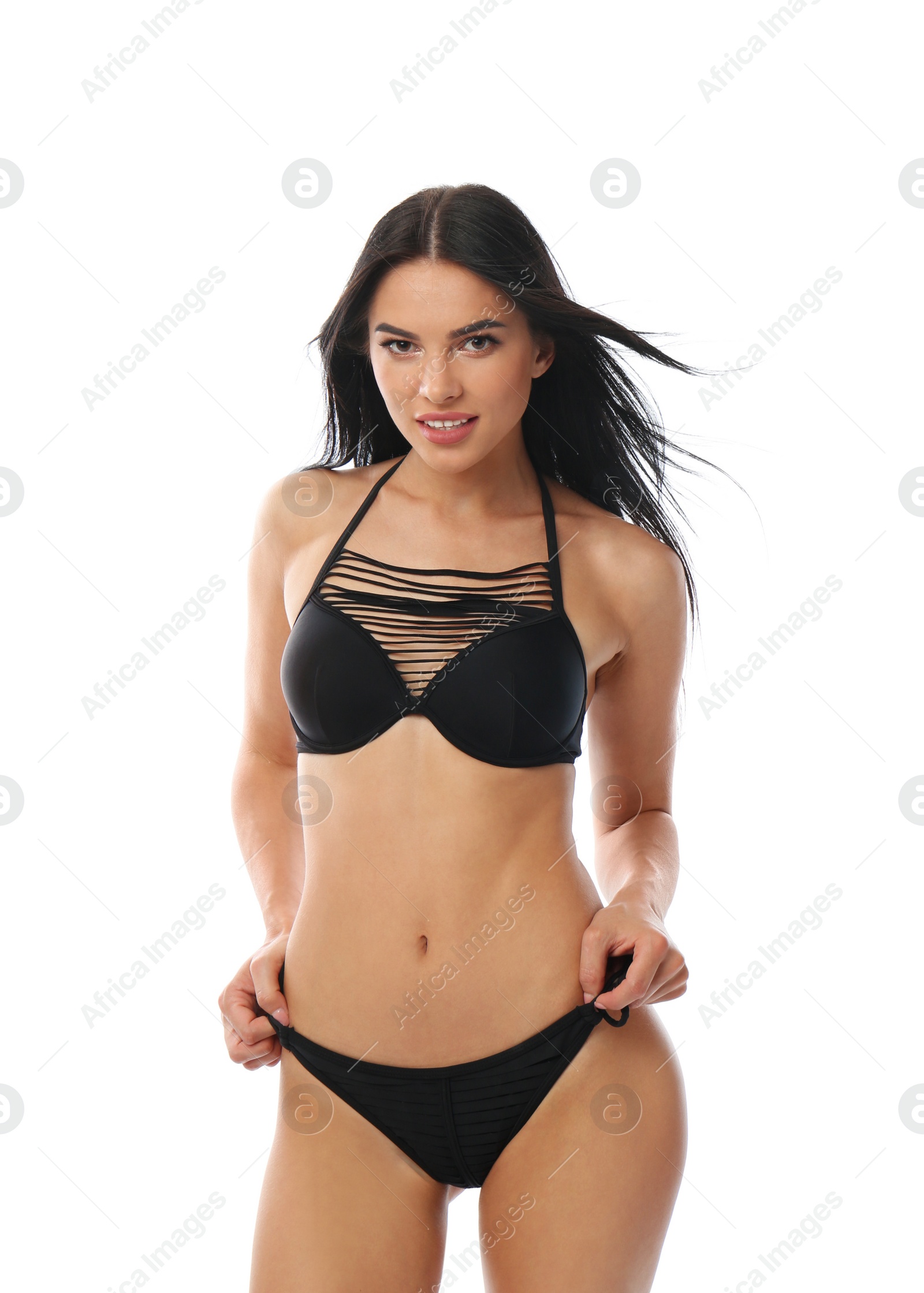 Photo of Beautiful young woman in black bikini on white background