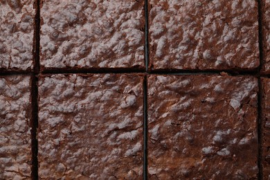 Closeup of delicious chocolate brownie as background, top view