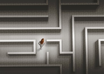 Image of Businesswoman trying to find way out of maze, above view