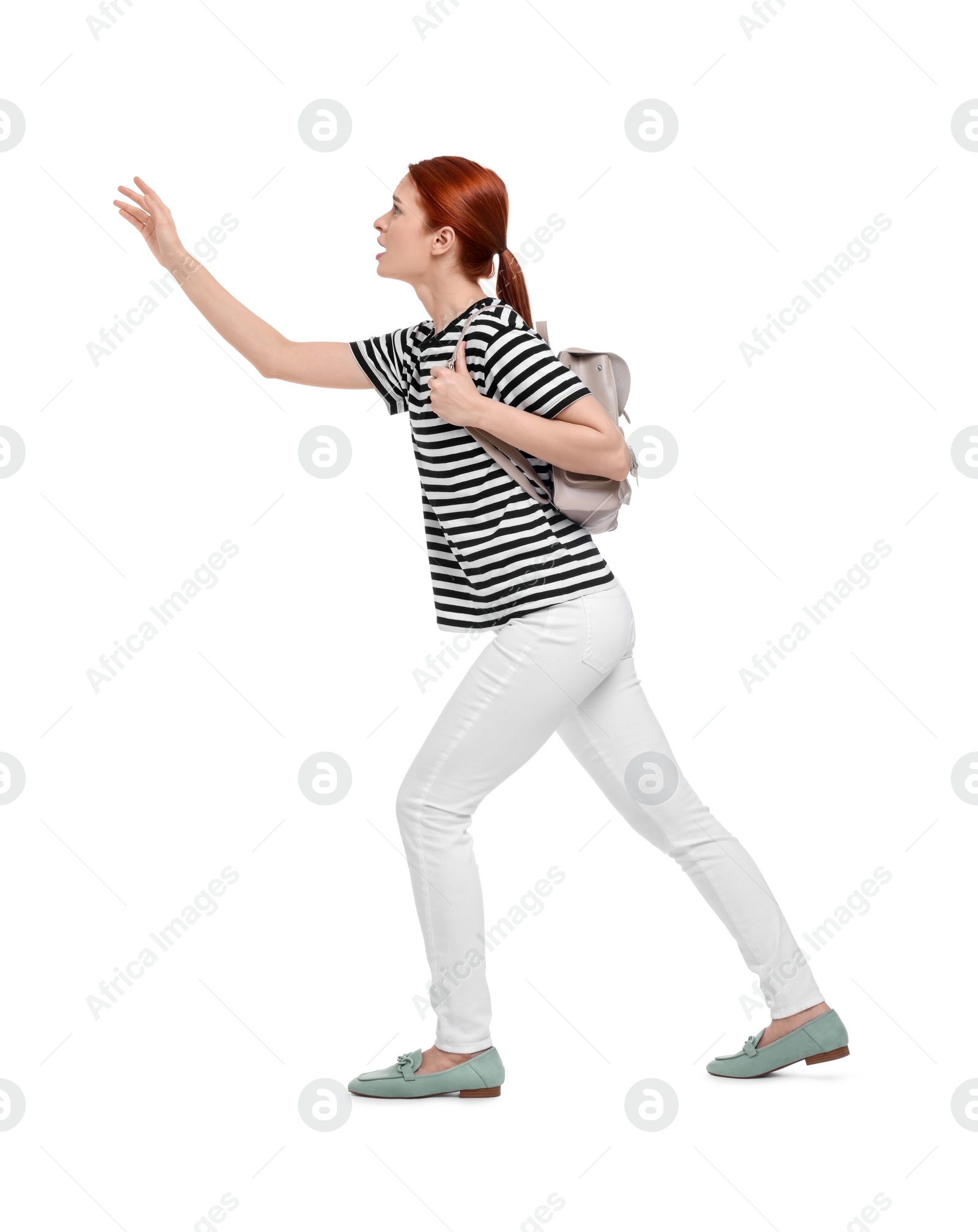 Photo of Worried woman with backpack on white background