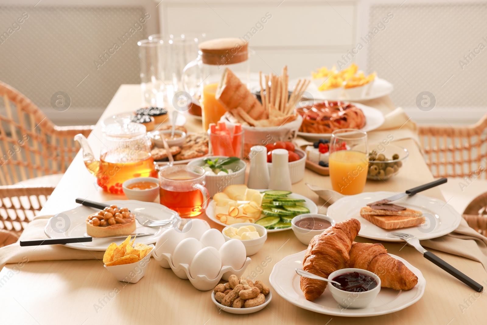 Photo of Dishes with different food on table in room. Luxury brunch