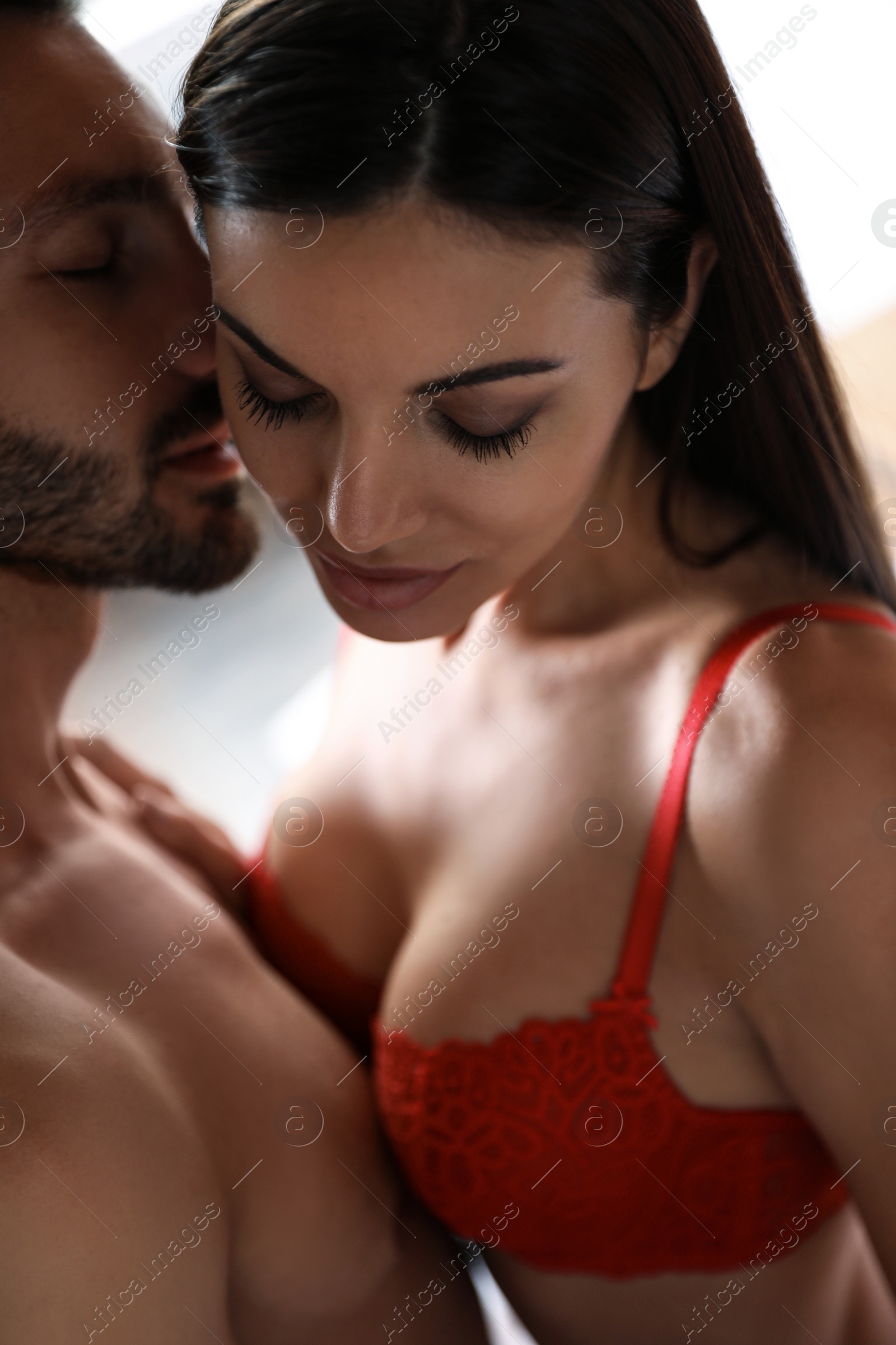 Photo of Passionate young couple having hot sex indoors