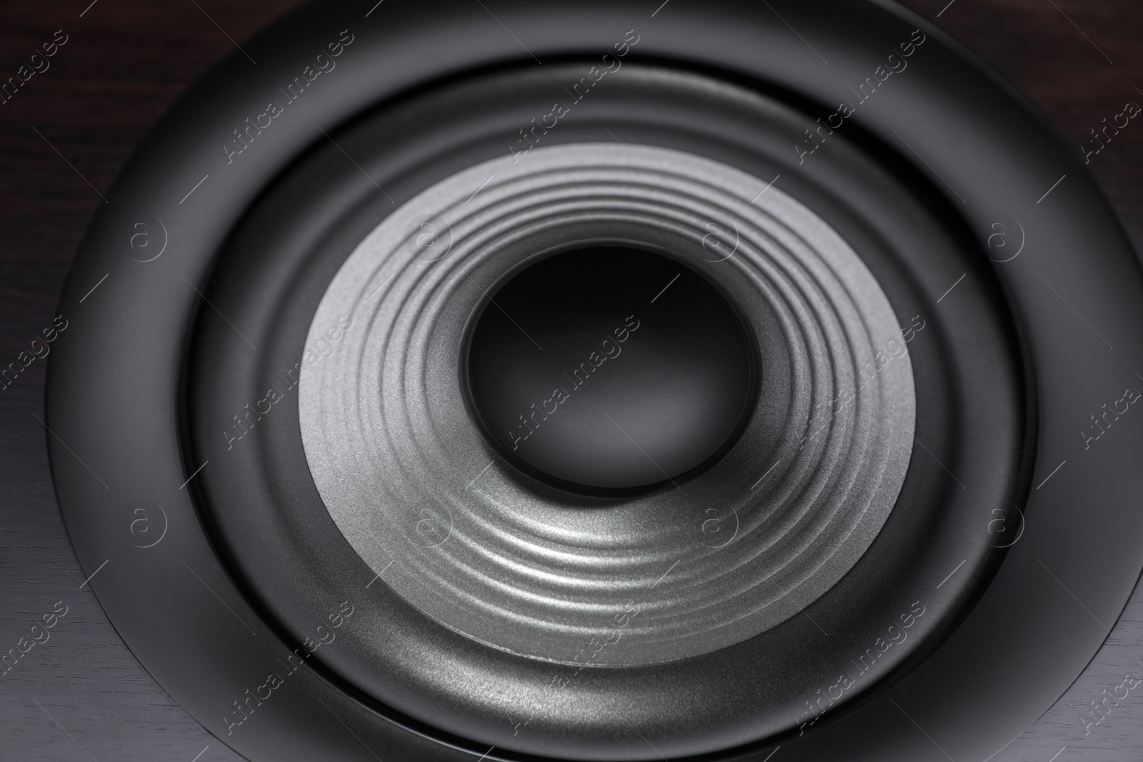 Photo of One wooden sound speaker as background, closeup