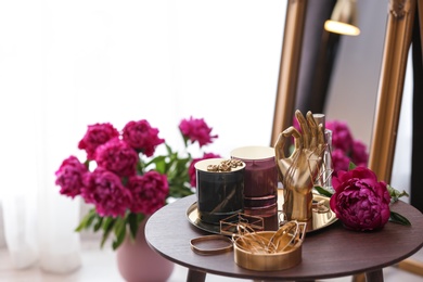 Photo of Composition with stylish accessories and interior elements on table indoors
