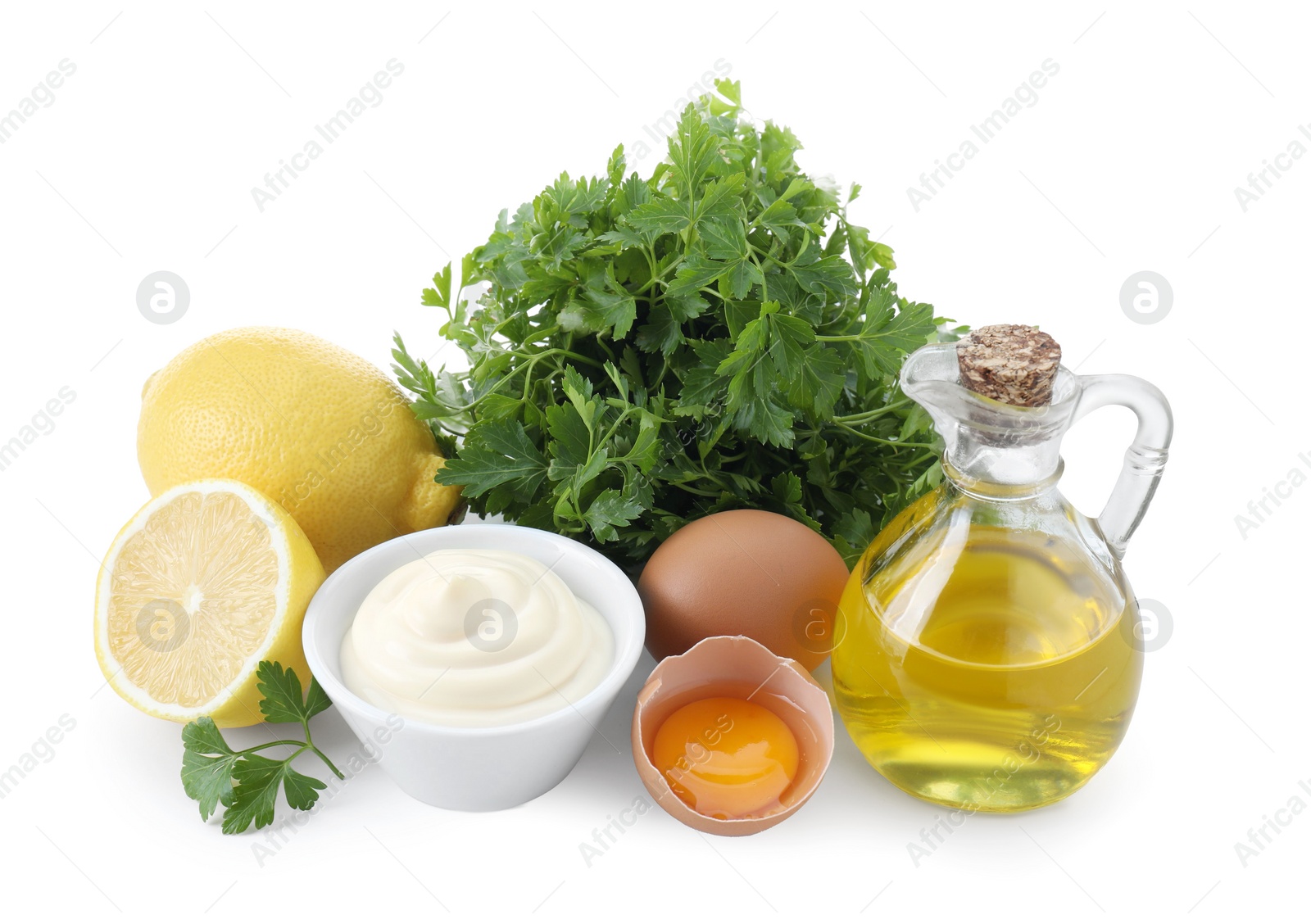 Photo of Tasty mayonnaise sauce in bowl and ingredients isolated on white