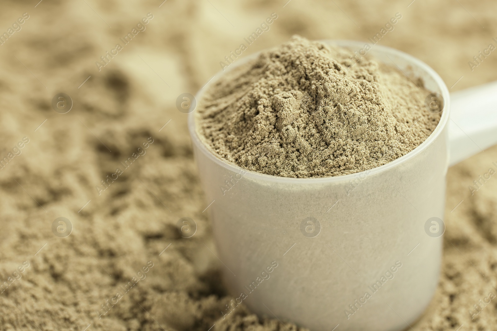 Photo of Measuring spoon and hemp protein powder, closeup. Superfood