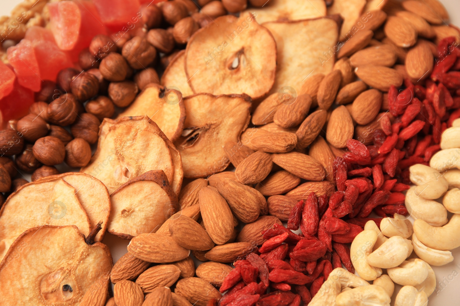 Photo of Mix of delicious dried nuts and fruits, closeup