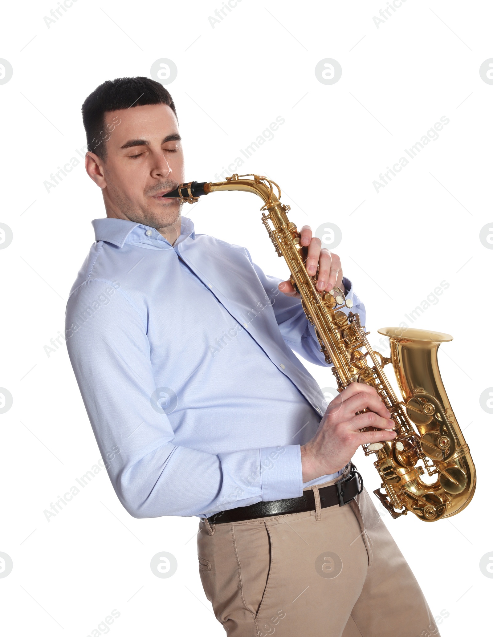 Photo of Young man playing saxophone on white background