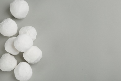 Photo of Snowballs on grey background, flat lay. Space for text