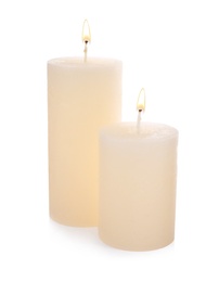 Photo of Stylish elegant beige candles on white background