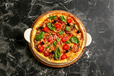 Photo of Tasty homemade pizza on table, top view