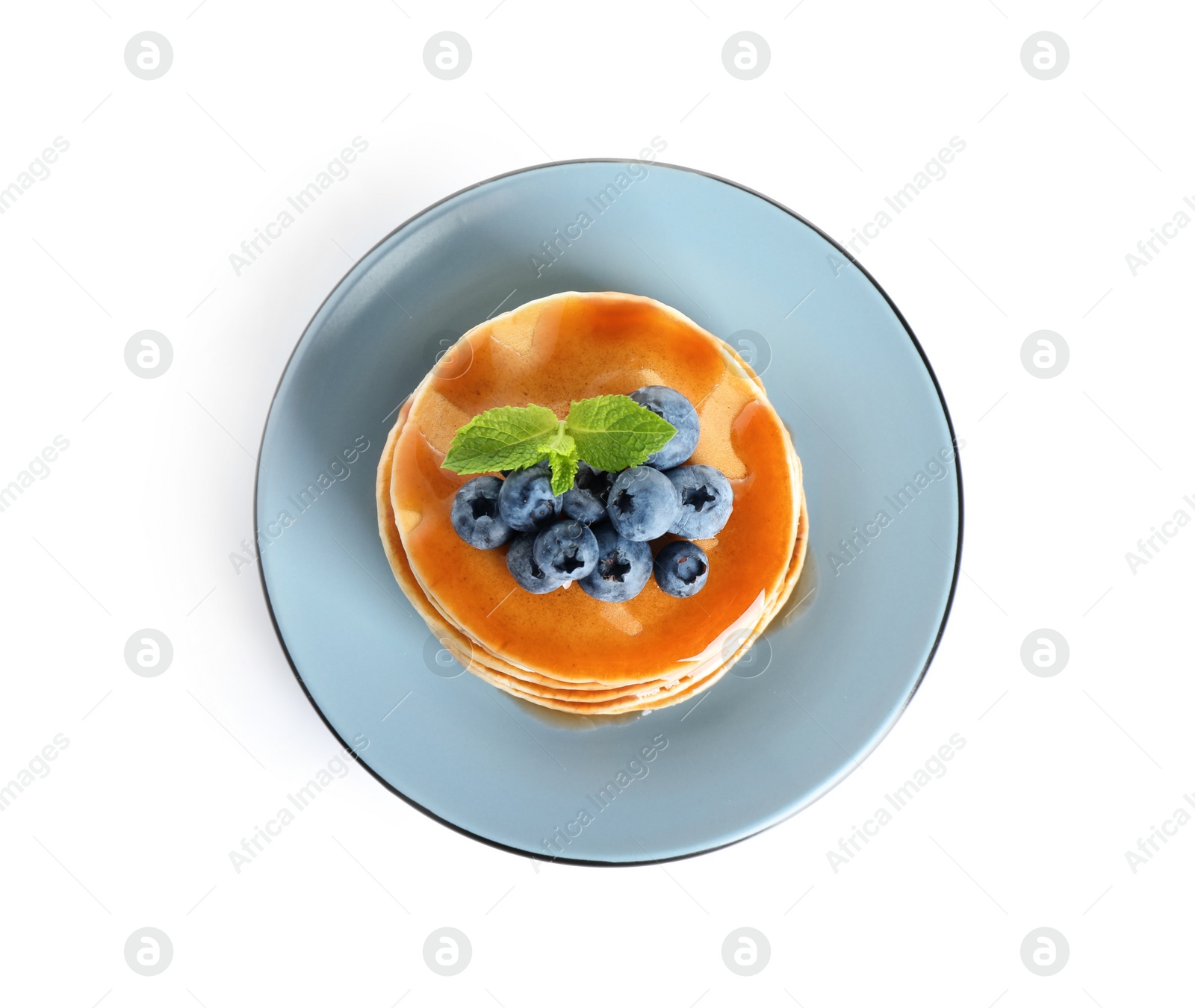 Photo of Plate of delicious pancakes with fresh blueberries and syrup on white background, top view