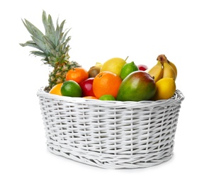 Photo of Basket with fresh tropical fruits on white background