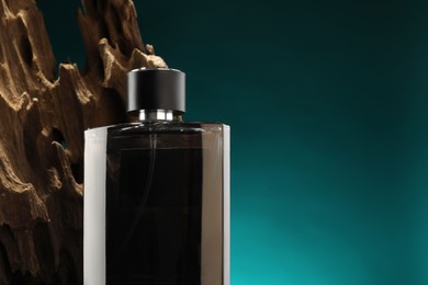 Luxury men`s perfume in bottle against color background, space for text