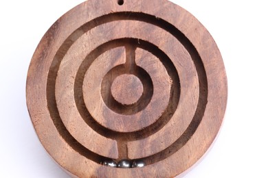 Wooden toy maze with metal balls on white background, top view