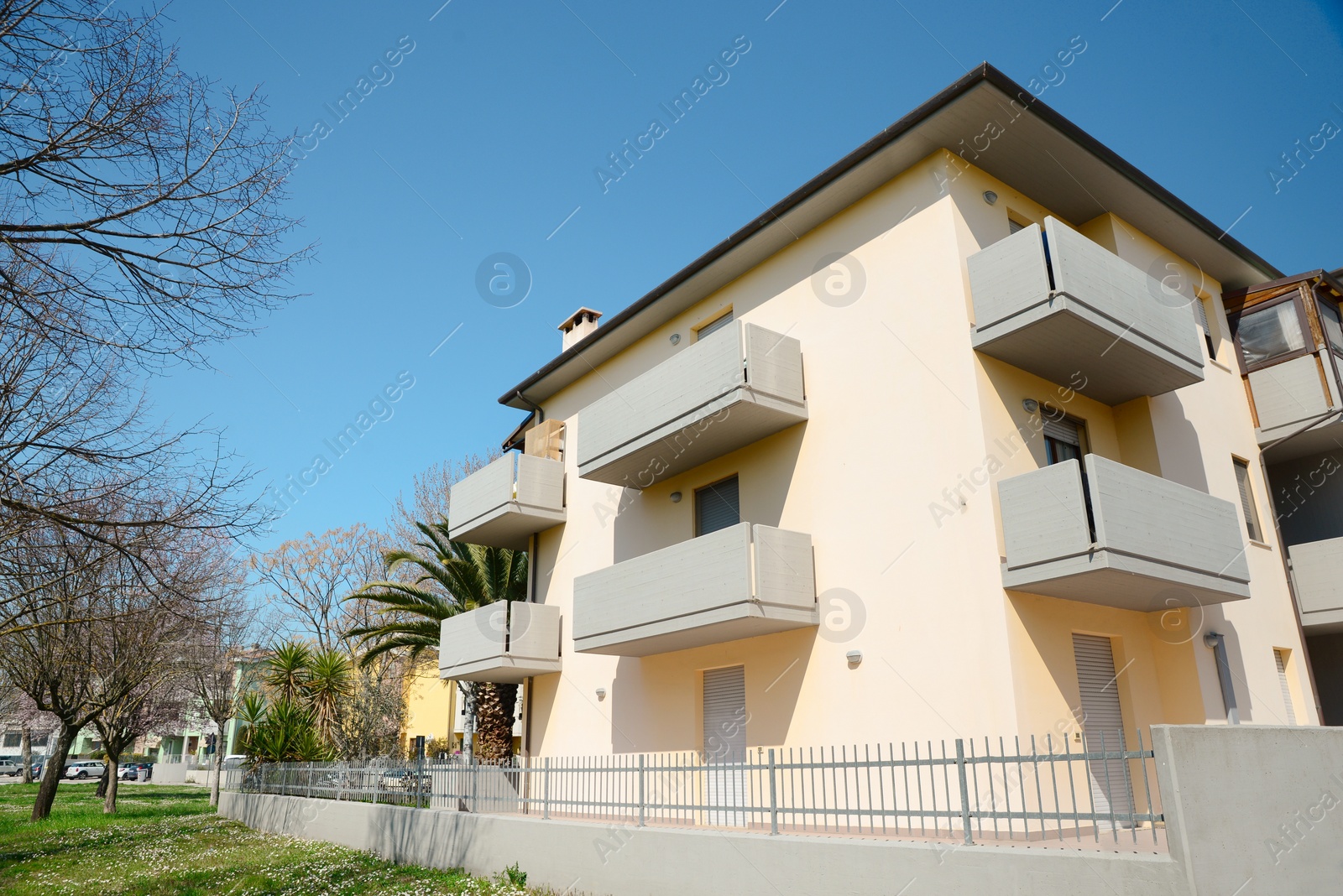 Photo of Picturesque view of beautiful building and trees on city street